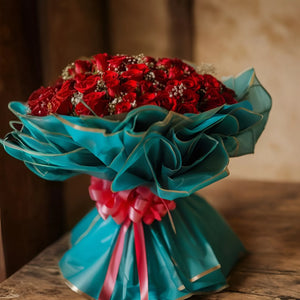 100 Red Roses in Green Premium Packing